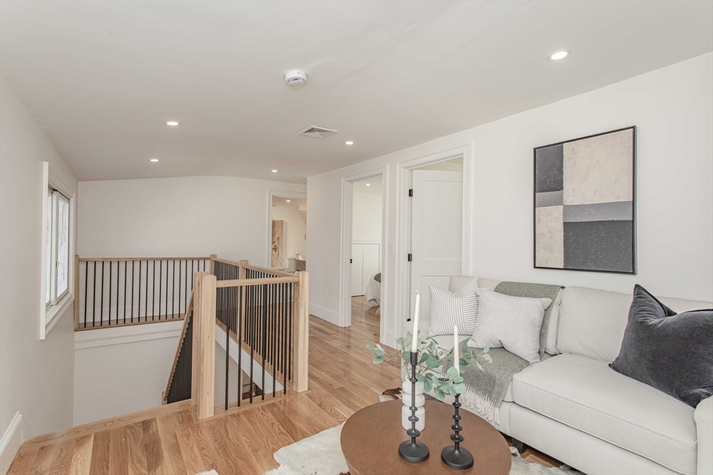 125 Mt Vernon Street, Unit 2 Newton, MA 02465 - Photo 27 of 36 a living room with furniture and wooden floor