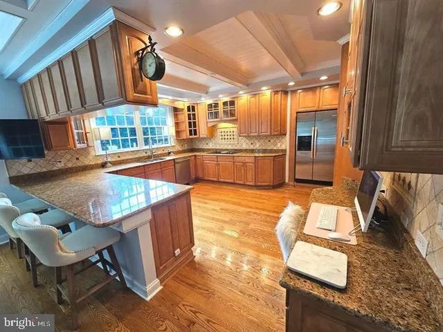 a view of a kitchen with furniture and a large window