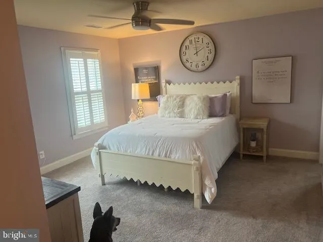 a bathroom with a bathtub shower sink vanity and toilet