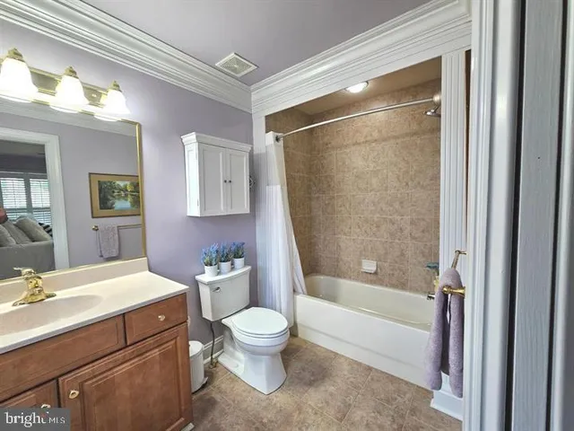 a bedroom with a bed lamp and window