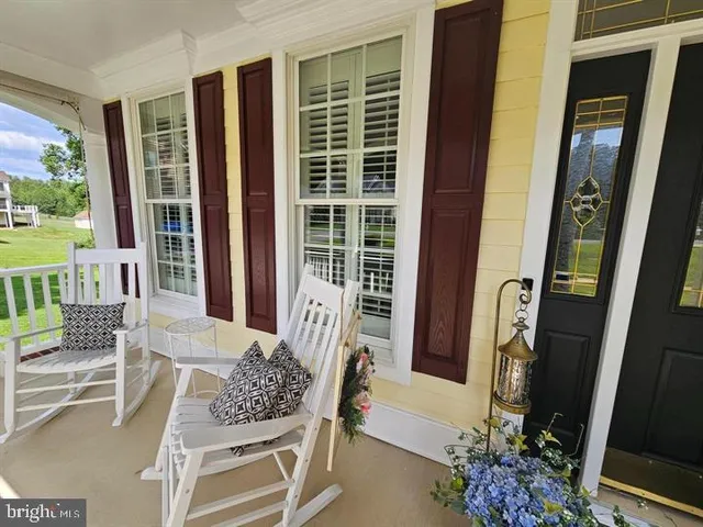 a view of balcony with furniture