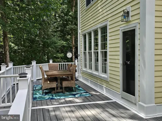 a view of a chair and table in the balcony