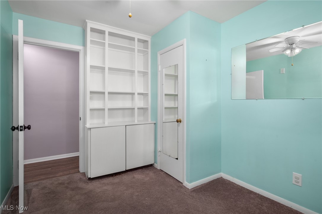 808 Bell Road Chagrin Falls, OH 44022 - Photo 17 of 28 Unfurnished bedroom with dark carpet and a closet