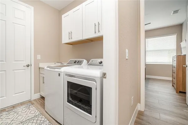 a storage room with washer and dryer
