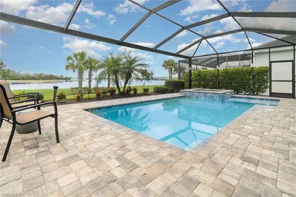 a view of a swimming pool with a patio