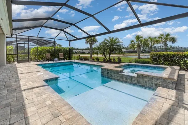 a view of a swimming pool with a patio
