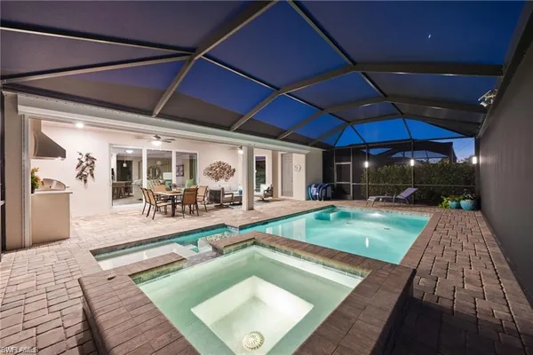 a view of swimming pool with outdoor seating