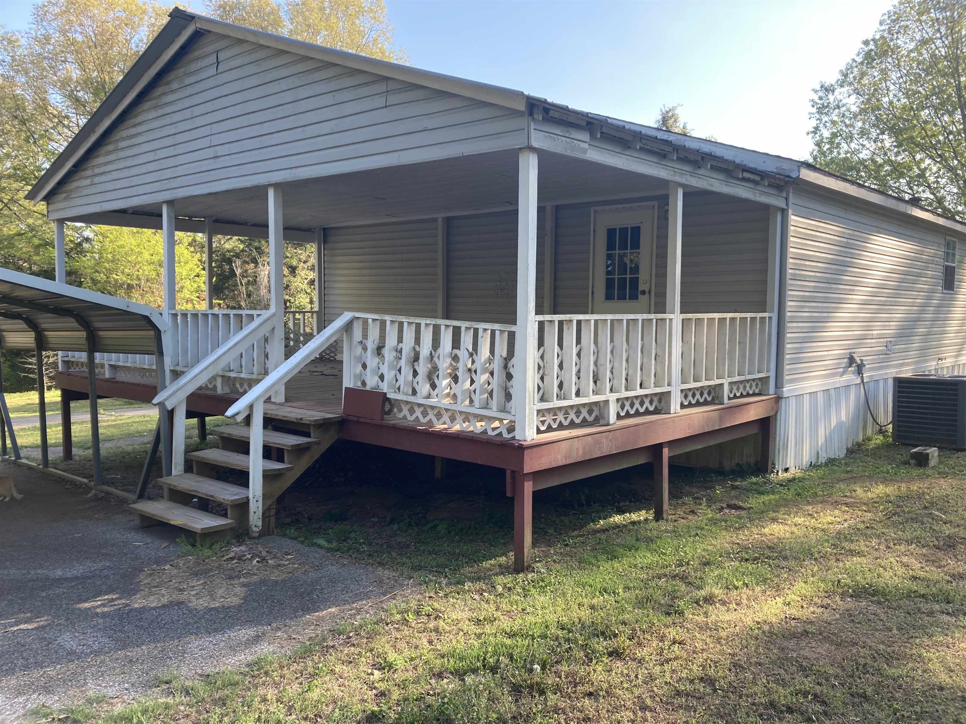 840 Rose Road Somerville, TN 38068 - Photo 2 of 21 Rear view of property with a wooden deck and a yard