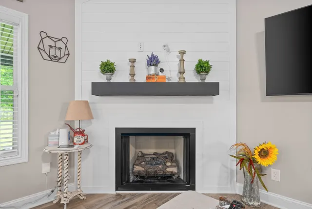 a living room with furniture and a fireplace