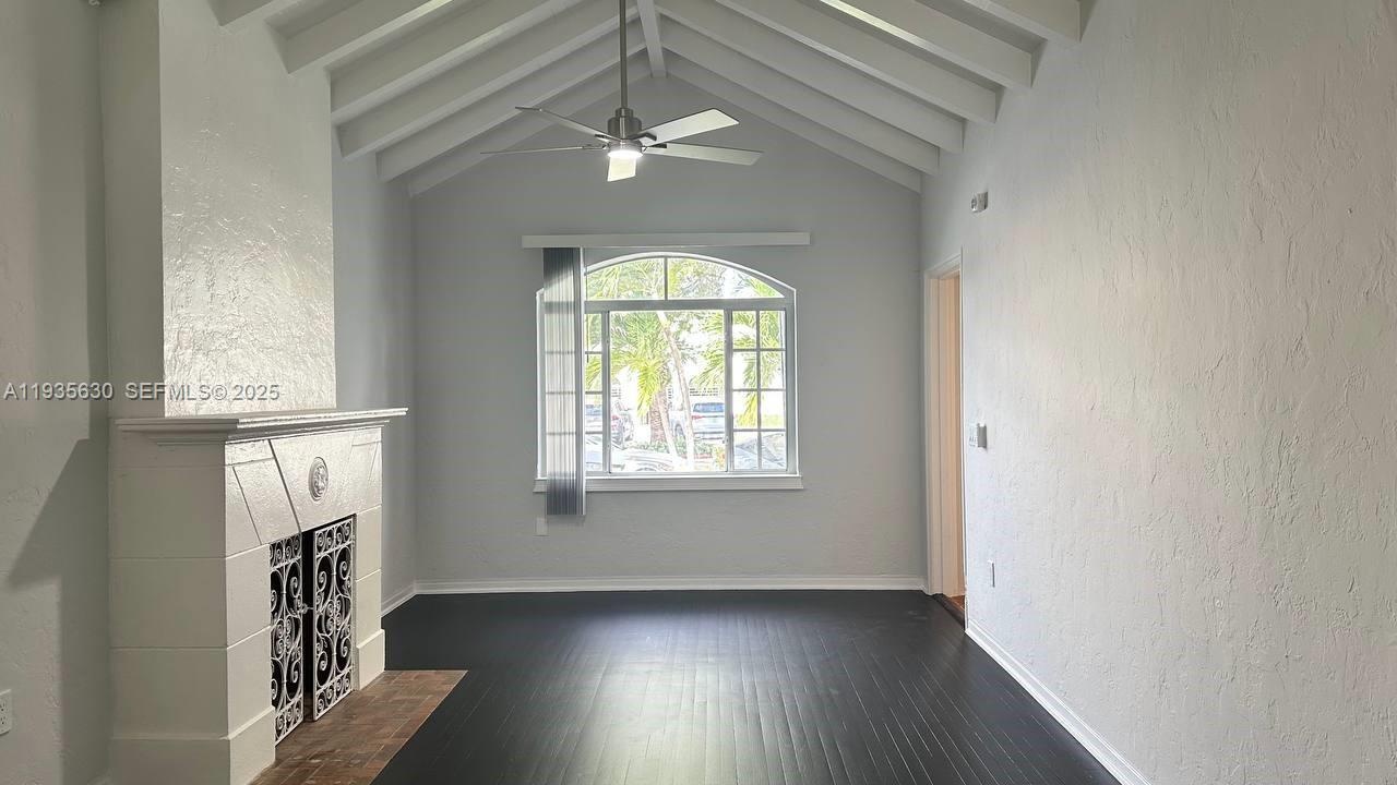 1824 Southwest 24th Street Miami, FL 33145 - Photo 13 of 35 an empty room with wooden floor fan and windows