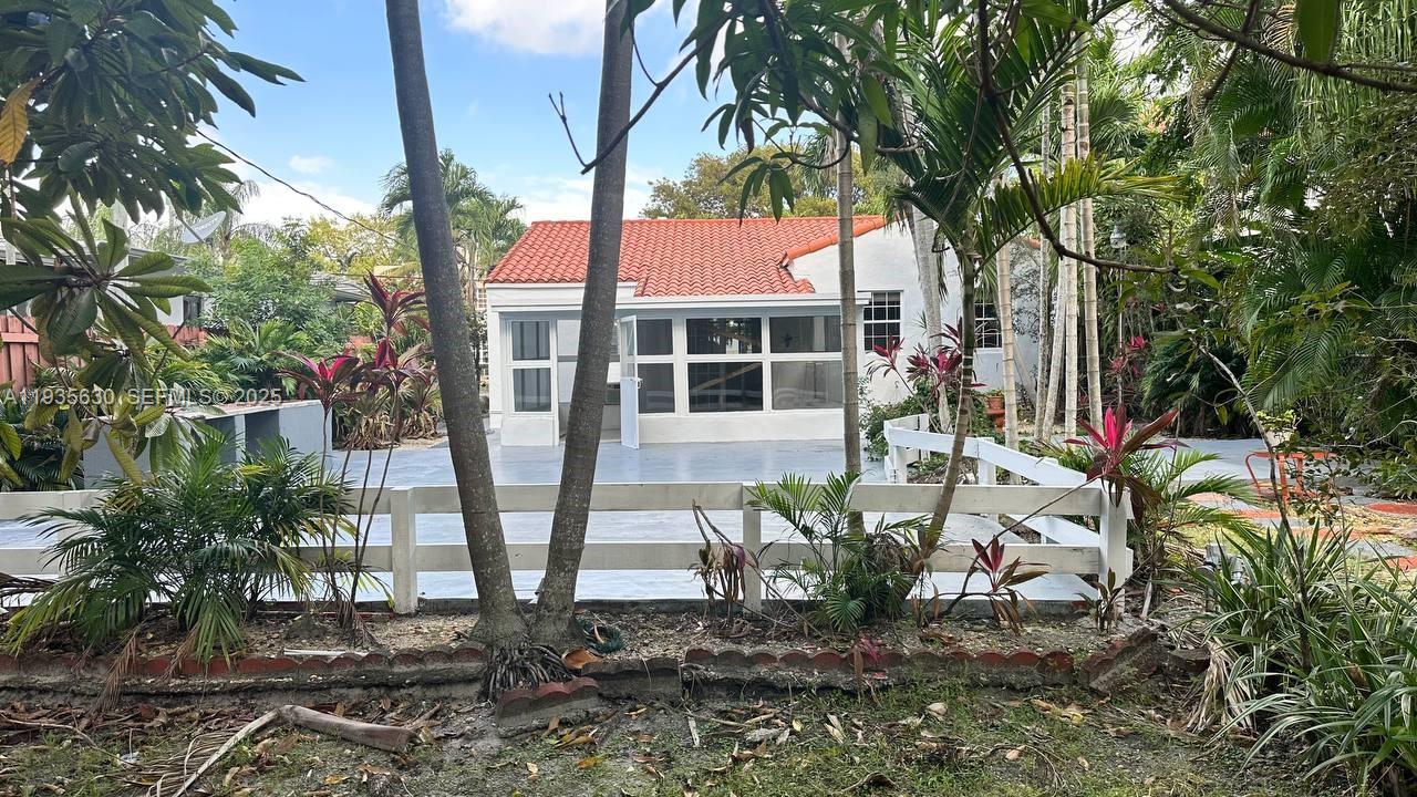 1824 Southwest 24th Street Miami, FL 33145 - Photo 26 of 35 a view of a chairs and table in a backyard