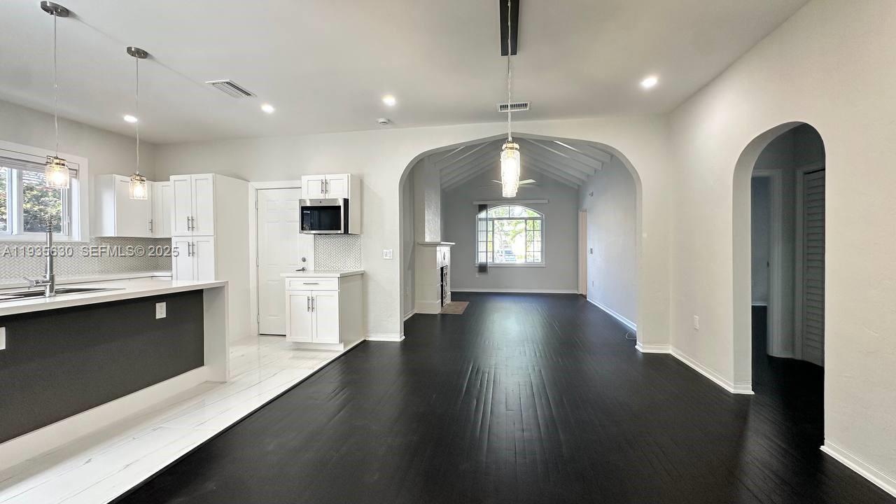1824 Southwest 24th Street Miami, FL 33145 - Photo 8 of 35 a view of a kitchen with lot of cabinets and stainless steel appliances
