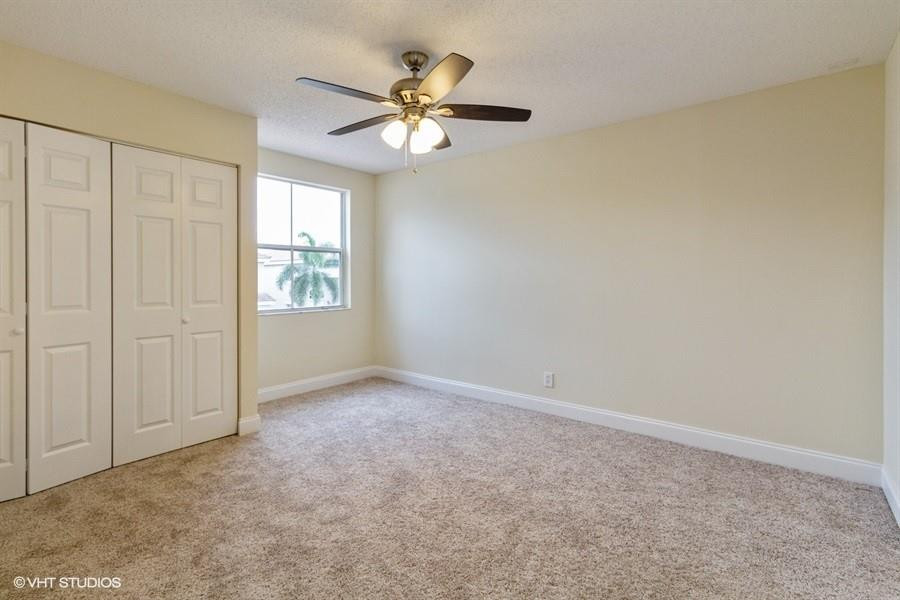 7463 Viscaya Circle Margate, FL 33063 - Photo 12 of 22 an empty room with windows and fan