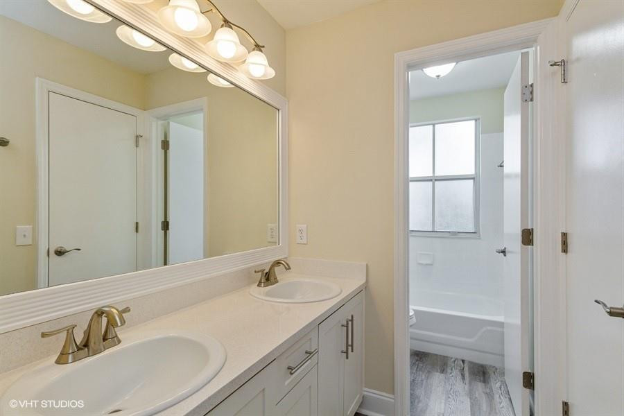 7463 Viscaya Circle Margate, FL 33063 - Photo 14 of 22 a bathroom with a sink and a mirror