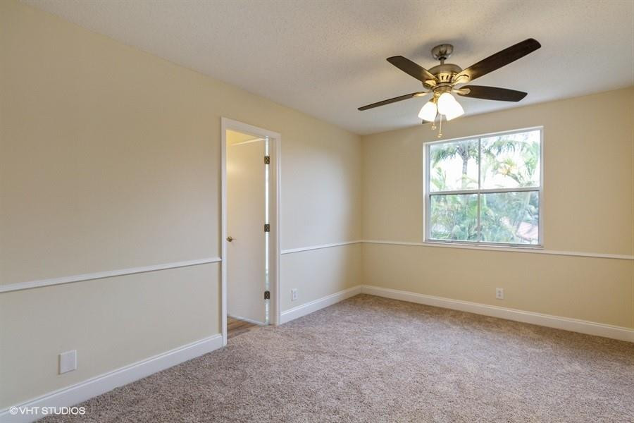 7463 Viscaya Circle Margate, FL 33063 - Photo 15 of 22 an empty room with windows and fan