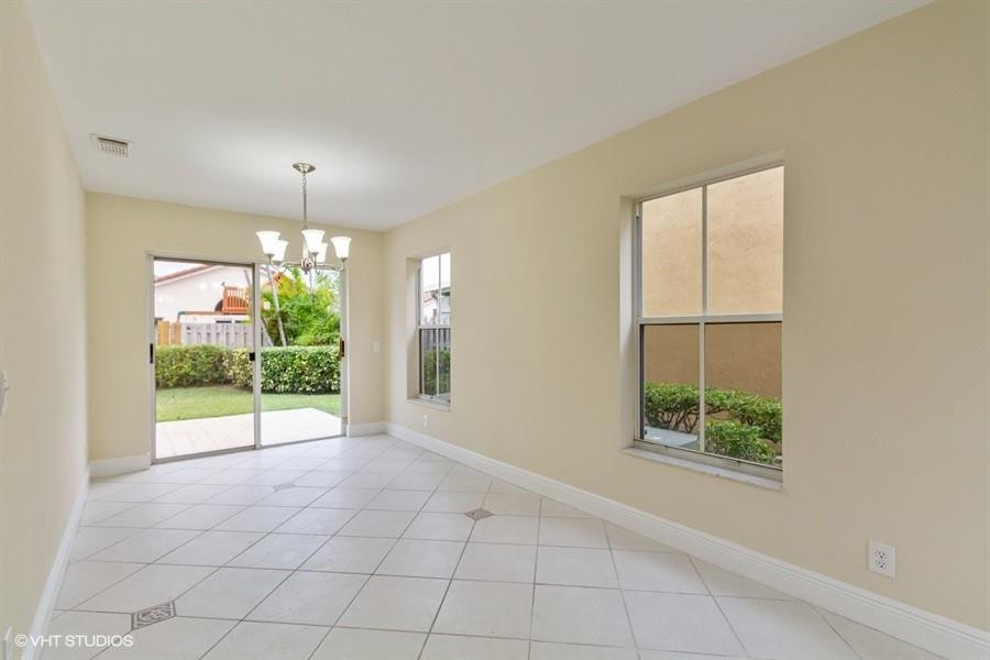 7463 Viscaya Circle Margate, FL 33063 - Photo 6 of 22 an empty room with windows and outdoor view