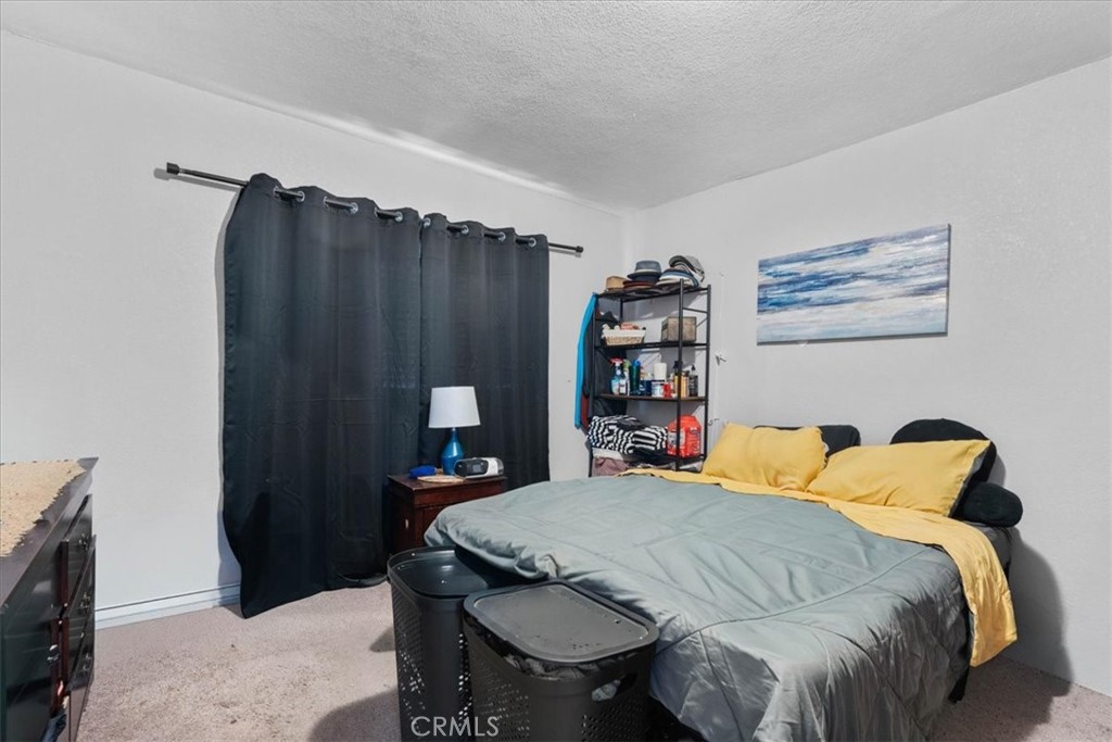 3974 5th Street Riverside, CA 92501 - Photo 21 of 45 a bedroom with a bed and a furniture