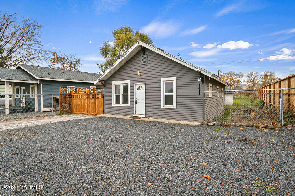 10710 Hughes Road Yakima, WA 98903 - Photo 2 of 21 a view of a house with a backyard