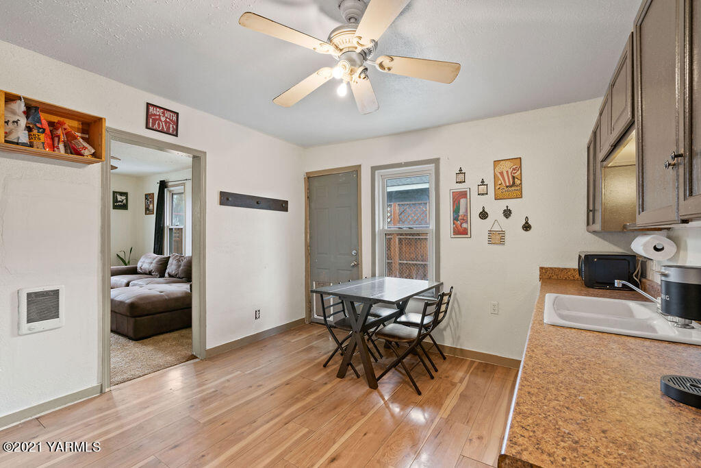 10710 Hughes Road Yakima, WA 98903 - Photo 8 of 21 a living room with furniture and a wooden floor