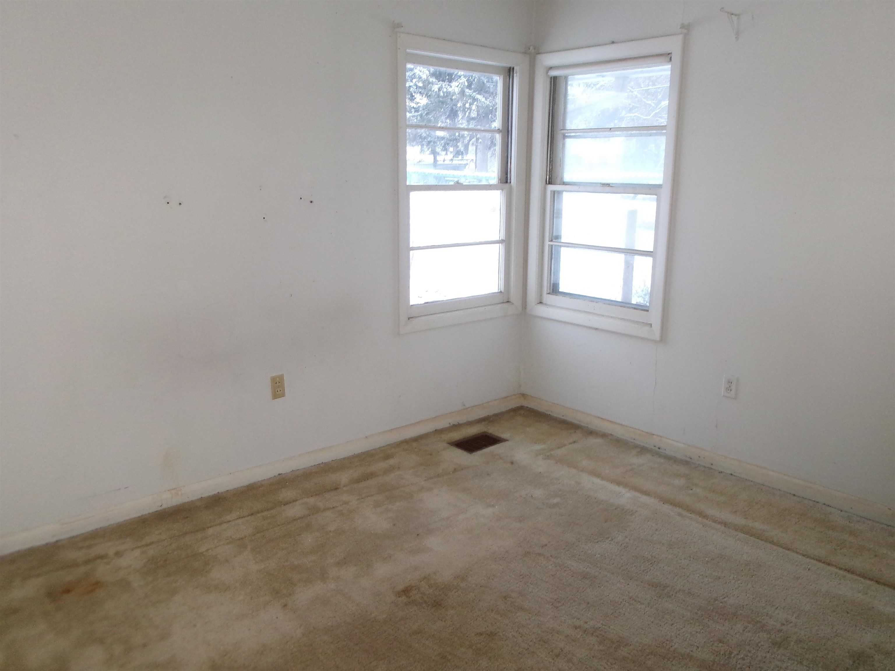 321 Meltzer Street Walnut, IL 61376 - Photo 3 of 10 an empty room with a window