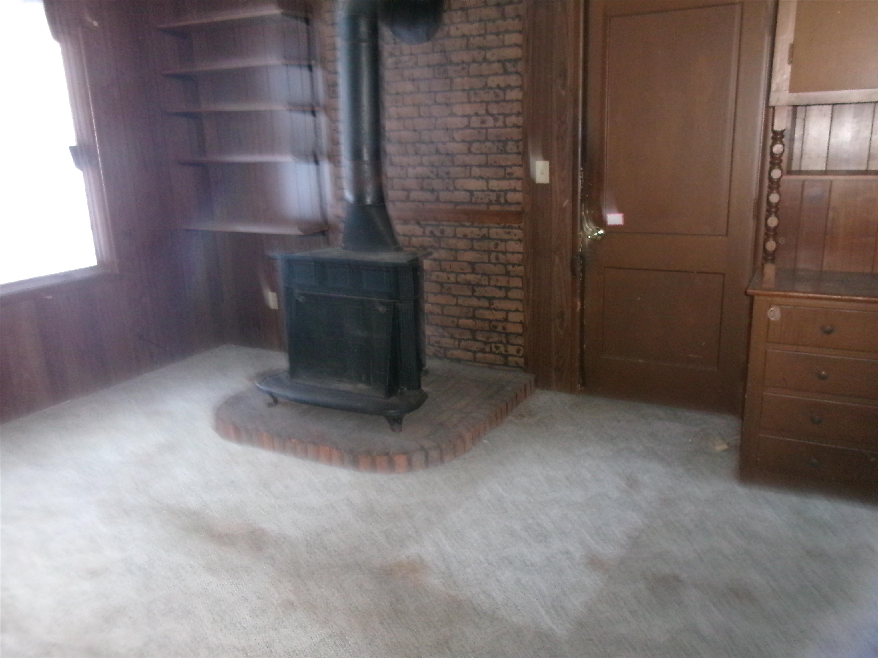 321 Meltzer Street Walnut, IL 61376 - Photo 5 of 10 a view of an empty room and fire place