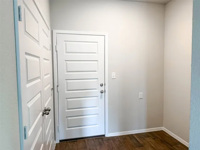 a view of a kitchen with a sink cabinets and wooden floor