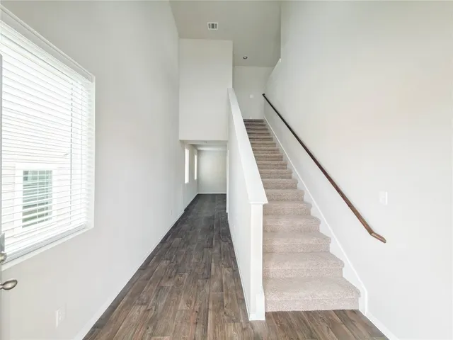 a view of entryway with wooden floor