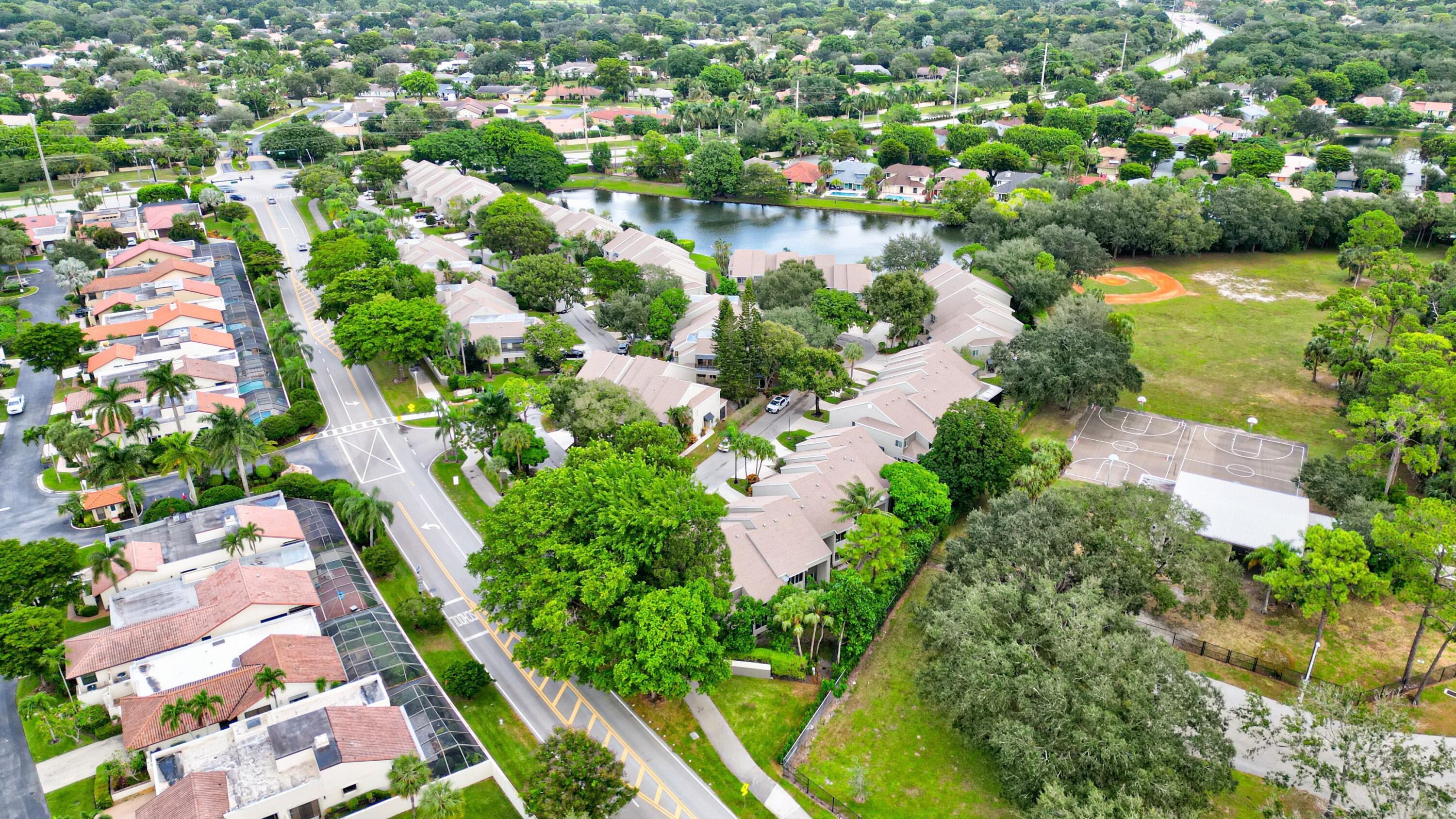6663 Boca Pines Trail, Unit A Boca Raton, FL 33433 - Photo 13 of 60 an aerial view of residential houses with outdoor space and trees all around