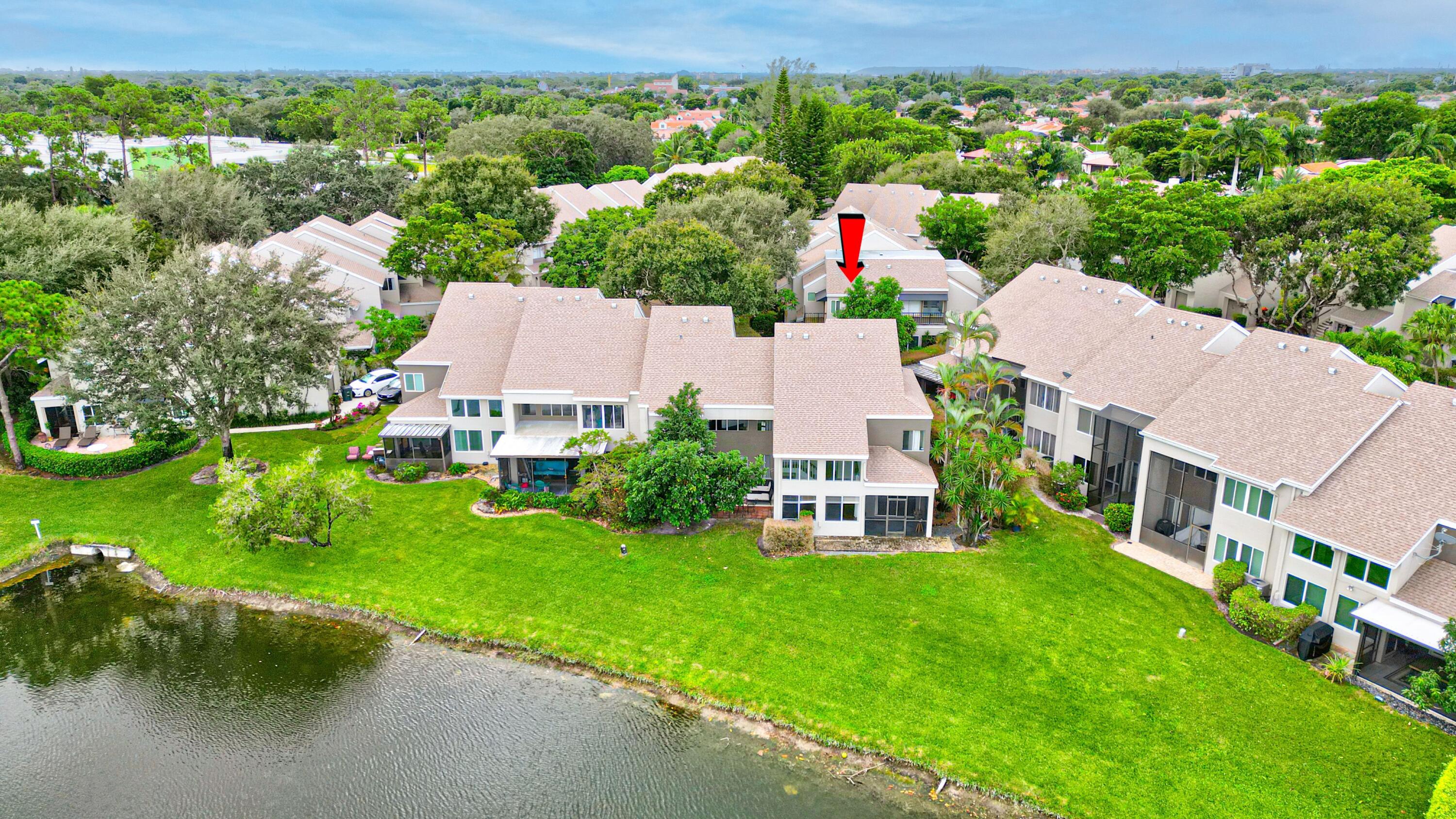 6663 Boca Pines Trail, Unit A Boca Raton, FL 33433 - Photo 20 of 60 an aerial view of a house with a garden and houses