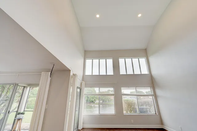 a kitchen with wooden floors and stainless steel appliances