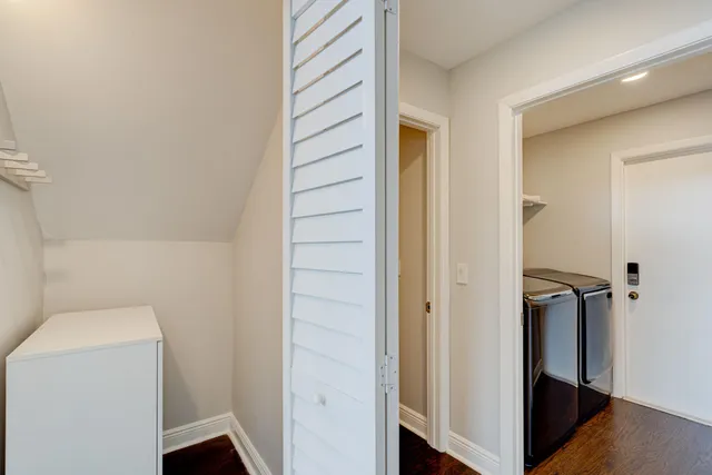 a bathroom with a granite countertop sink toilet mirror and shower