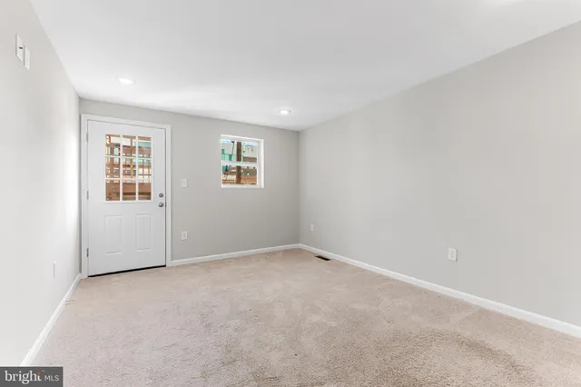 a view of a balcony with wooden floor and fence