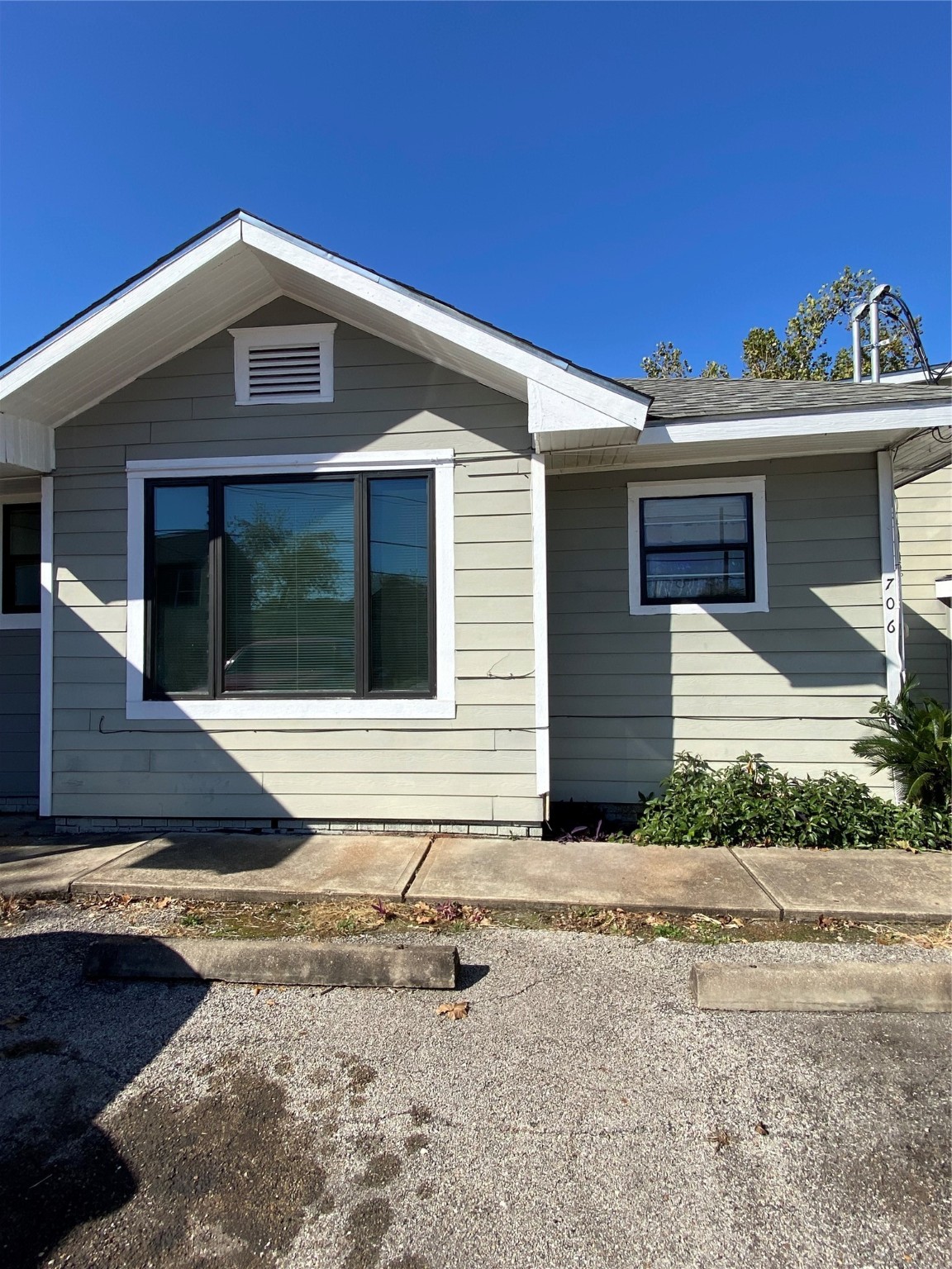 706 Dumble Street Houston, TX 77023 - Photo 13 of 13 a front view of a house with a yard and garage