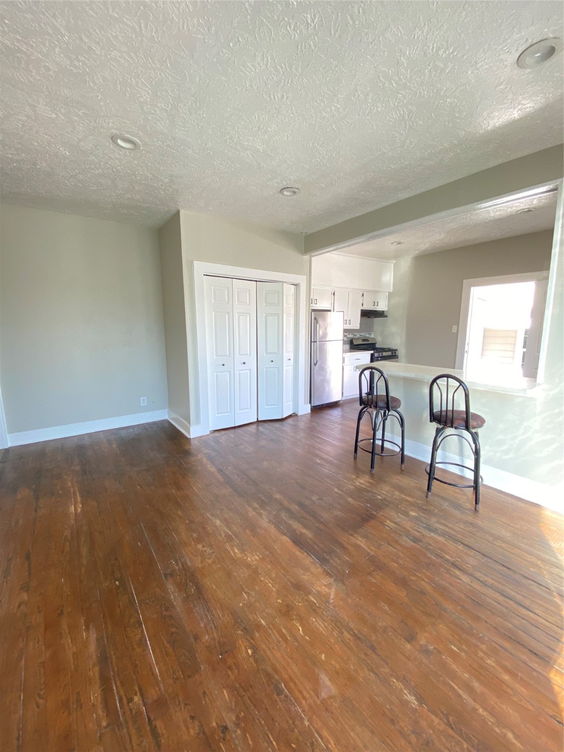 706 Dumble Street Houston, TX 77023 - Photo 6 of 13 a view of a livingroom with furniture and wooden floor