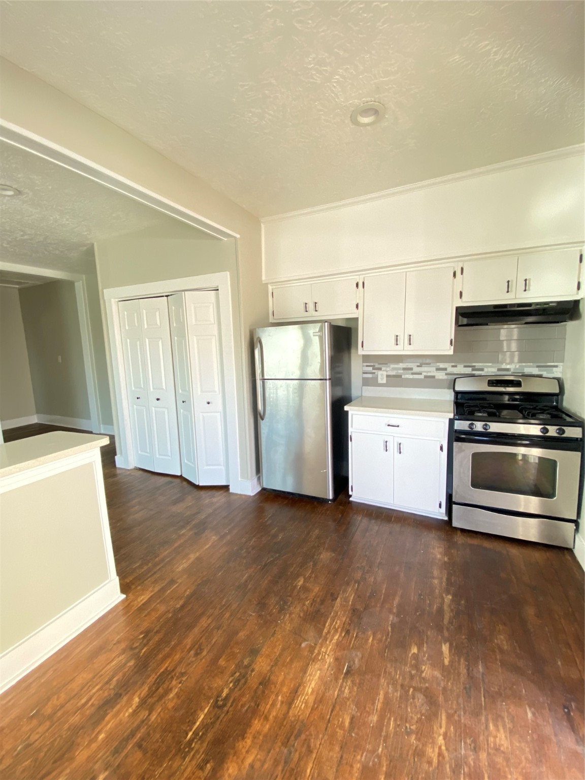 706 Dumble Street Houston, TX 77023 - Photo 8 of 13 a kitchen with a sink and a stove top oven