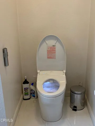 a bathroom with a toilet and a sink