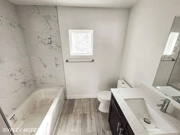 a bathroom with a sink and a bathtub