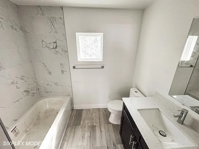 a bathroom with a sink and a bathtub