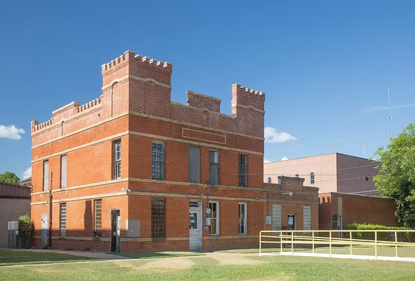 a view of a building with a yard