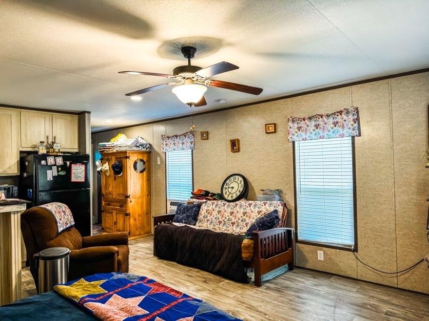 891 Tbd County Road Jewett, TX 75846 - Photo 13 of 22 a bedroom with furniture and a chandelier