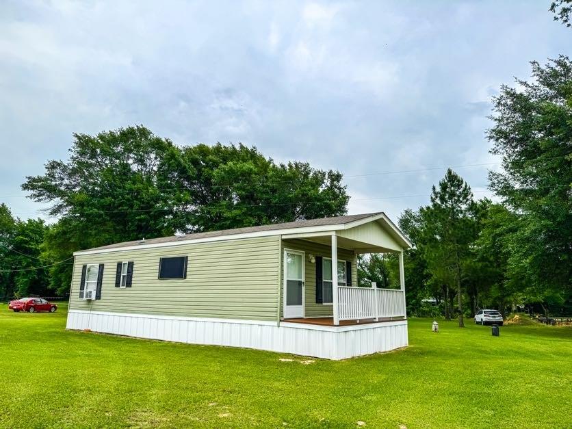 891 Tbd County Road Jewett, TX 75846 - Photo 19 of 22 a front view of house with yard and green space