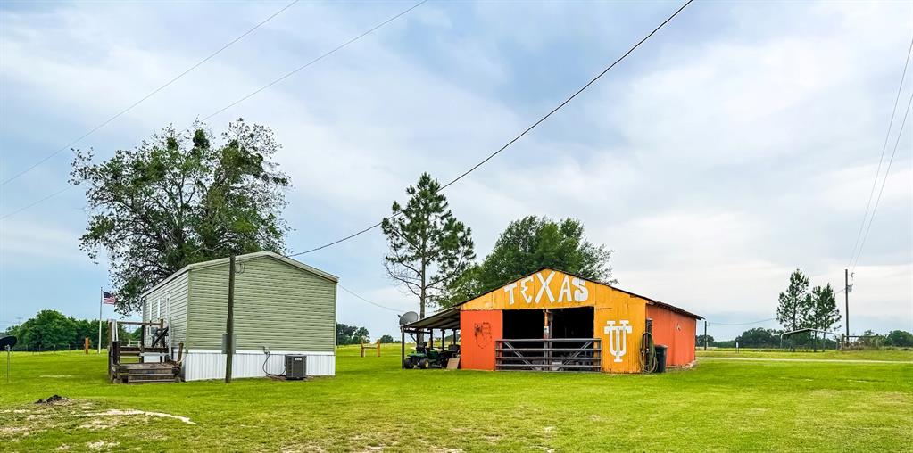 891 Tbd County Road Jewett, TX 75846 - Photo 2 of 22 a front view of house with yard and green space