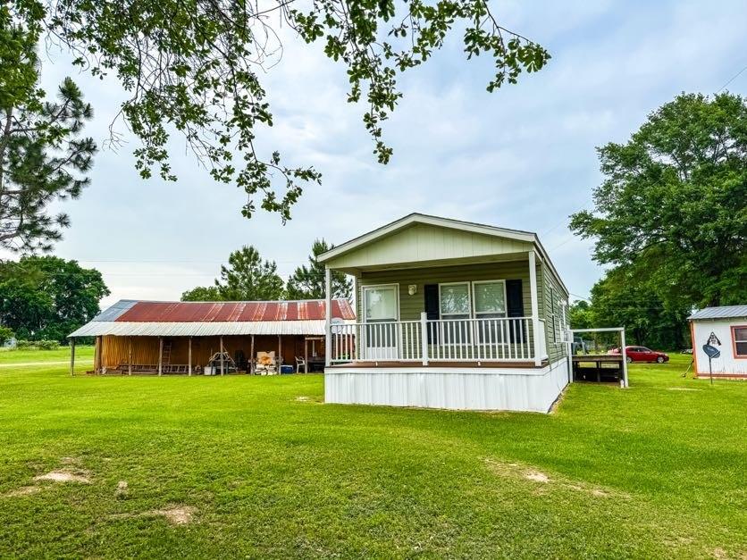 891 Tbd County Road Jewett, TX 75846 - Photo 22 of 22 a front view of a house with a garden
