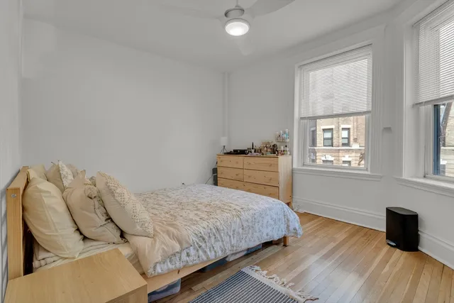 a bedroom with a bed and window
