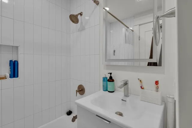 a bathroom with a sink and a shower