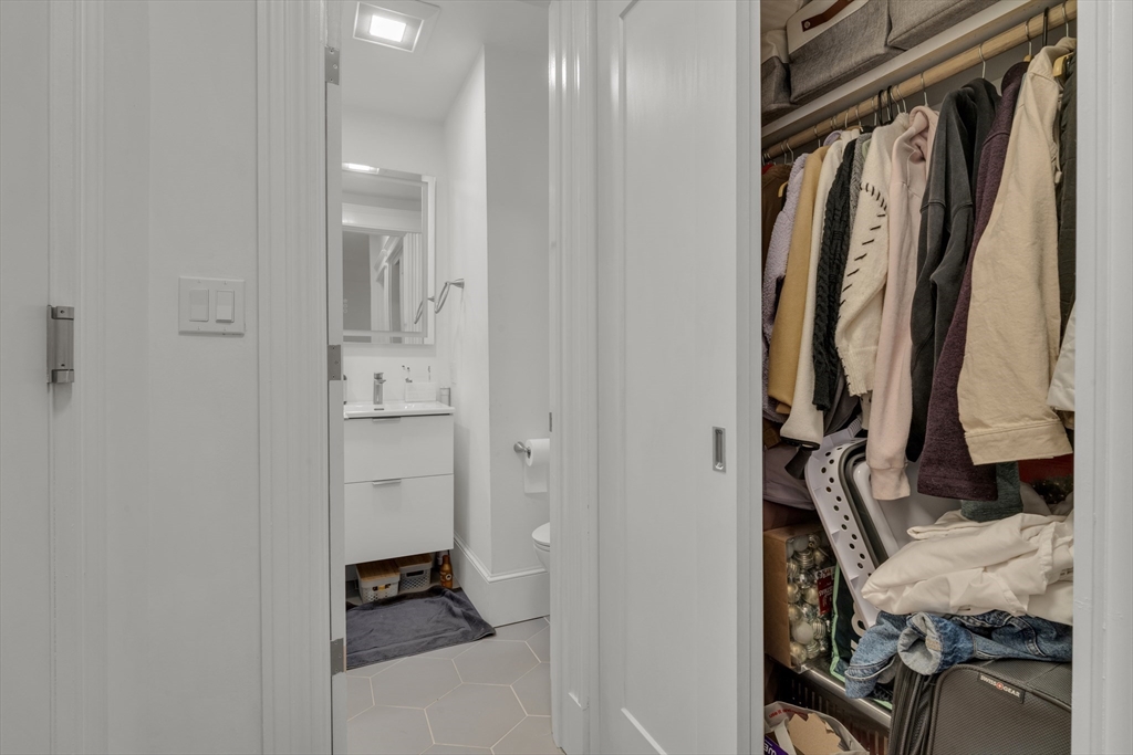 1082 Commonwealth Avenue, Unit 501 Boston, MA 02215 - Photo 5 of 6 a view of walk in closet with clothes