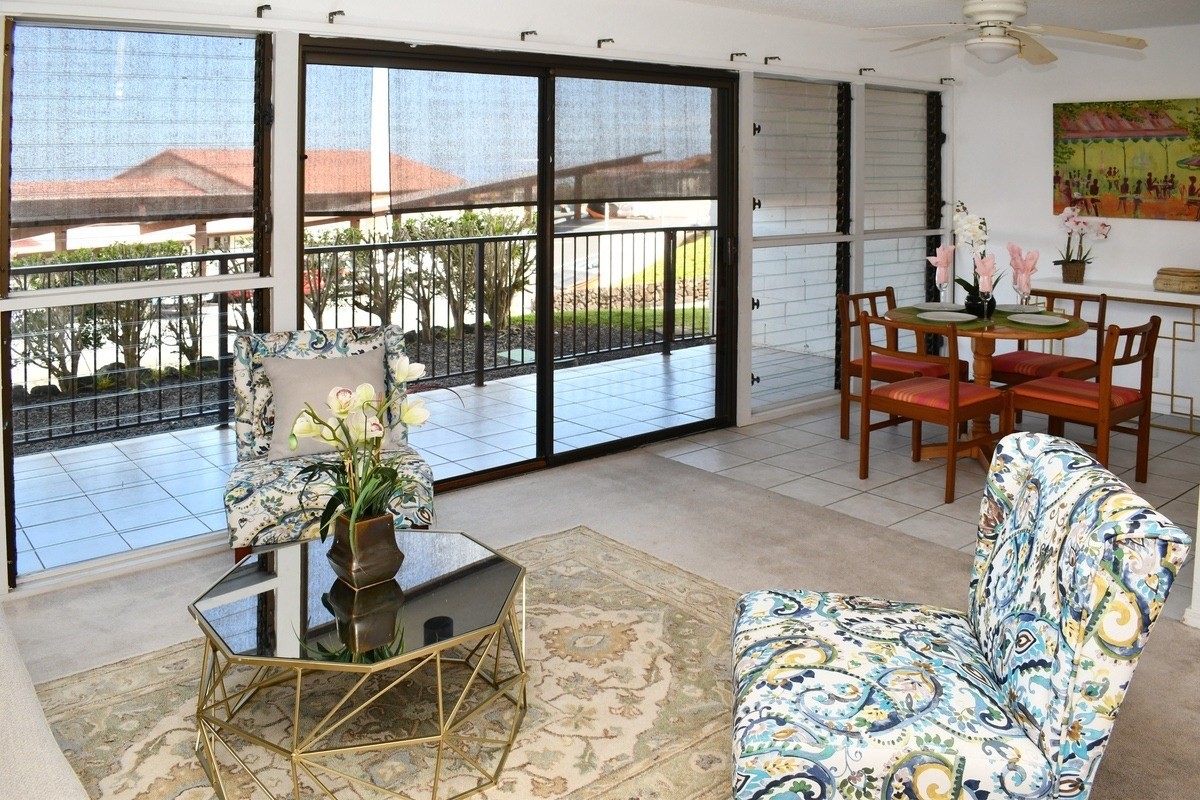 79-7199 Mamalahoa Highway, Unit 120 Holualoa, HI 96725 - Photo 1 of 25 a living room filled with furniture and a potted plant