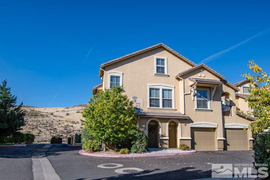 9050 Double R Boulevard, Unit NV Reno, NV 89521 - Photo 1 of 25 a front view of a house with a yard