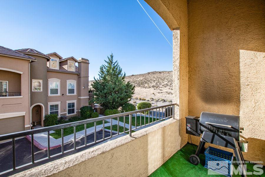 9050 Double R Boulevard, Unit NV Reno, NV 89521 - Photo 21 of 25 a view of a balcony with chairs