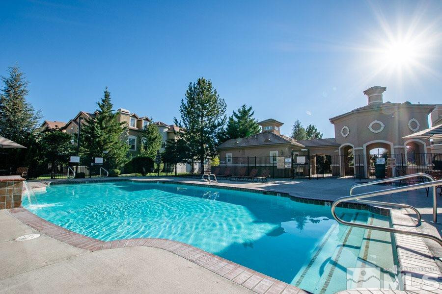 9050 Double R Boulevard, Unit NV Reno, NV 89521 - Photo 22 of 25 a front view of house with yard and outdoor seating